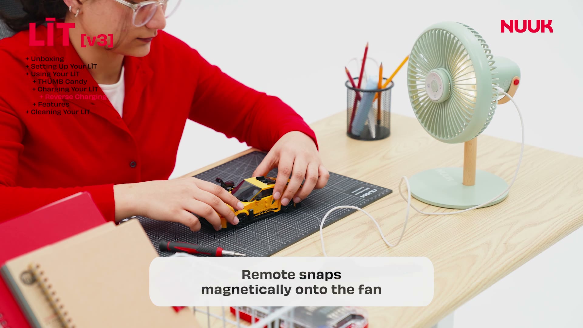 THŪMB Candy remote snapping magnetically onto the LĪT [v3]
